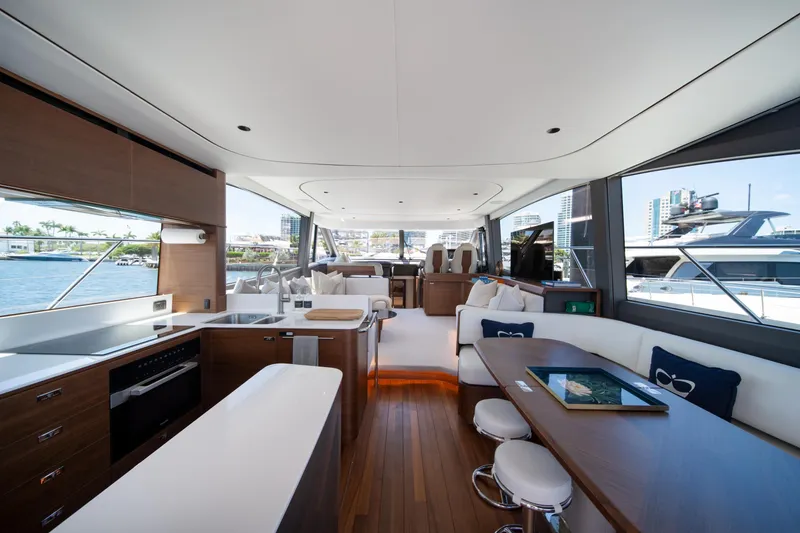 Slide: The Image of Luxurious interior of 2025 Princess F65 yacht with modern kitchen and seating area. - 10