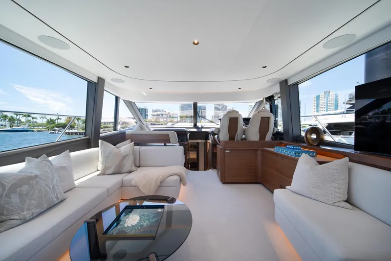 Slide: The Image of Luxurious interior of 2025 Princess F65 yacht with modern seating and panoramic windows. - 15