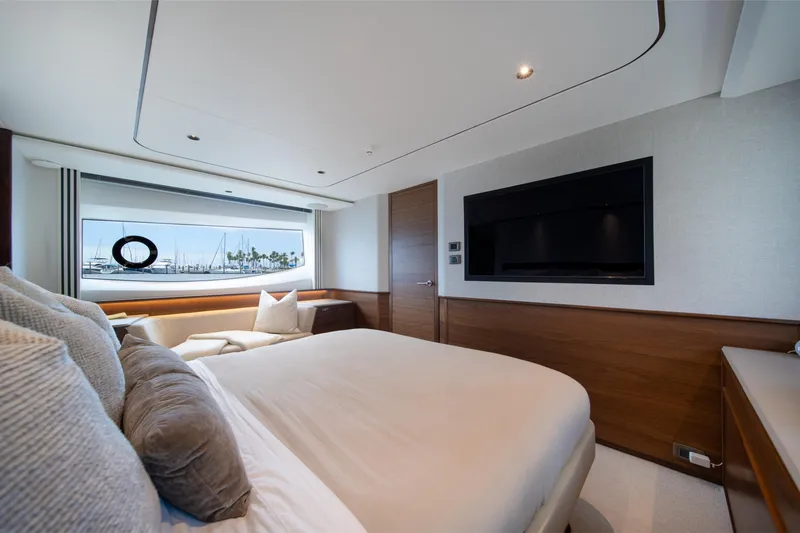 Slide: The Image of Luxurious bedroom interior of 2025 Princess F65 yacht with large window and modern decor. - 22