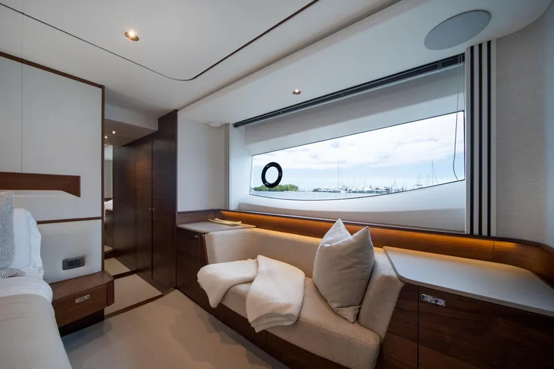 Slide: The Image of Luxurious interior of 2025 Princess F65 yacht with elegant seating and large window view. - 24