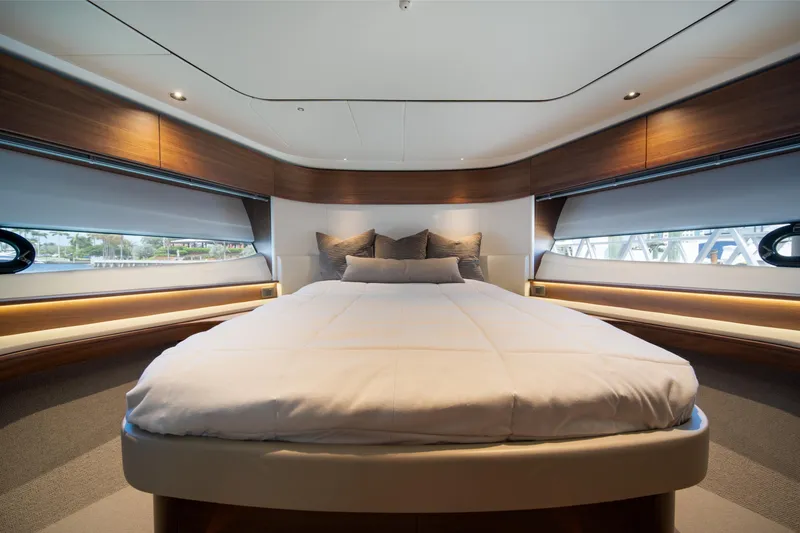 Slide: The Image of Luxurious bedroom interior of 2025 Princess F65 yacht with elegant wood accents. - 27