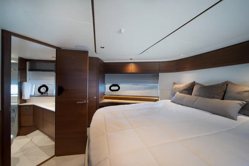 Slide: The Image of Luxurious bedroom interior of 2025 Princess F65 yacht with modern wood finishes. - 28