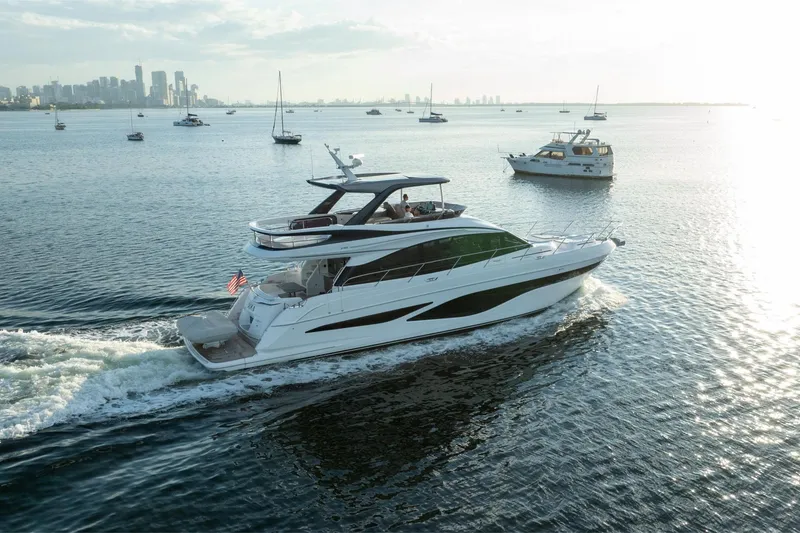 Slide: The Image of Luxurious 2025 Princess F65 yacht cruising in scenic waters near city skyline. - 3