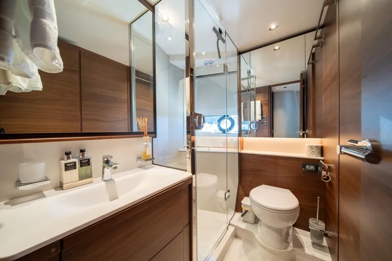 Slide: The Image of Luxurious bathroom in 2025 Princess F65 yacht with modern fixtures and wooden accents. - 30