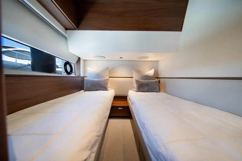 Slide: The Image of Luxurious twin cabin interior of 2025 Princess F65 yacht with modern design. - 32