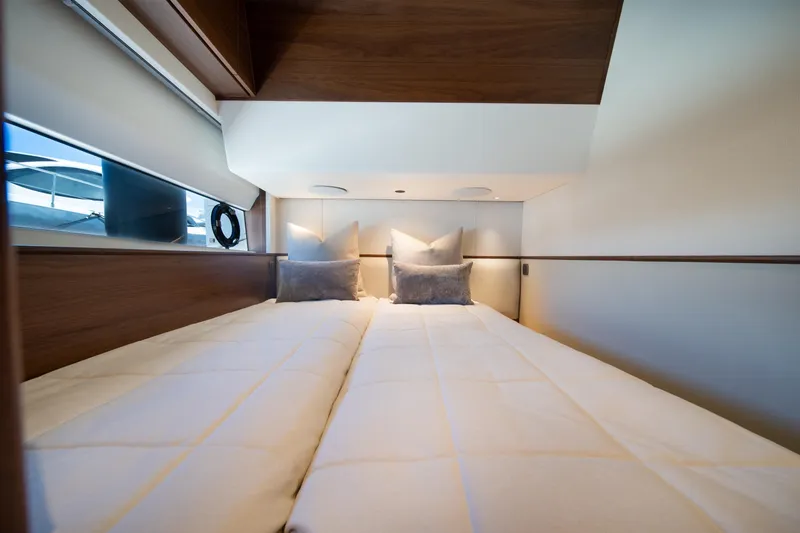 Slide: The Image of Luxurious cabin interior of 2025 Princess F65 yacht with cozy bedding. - 33