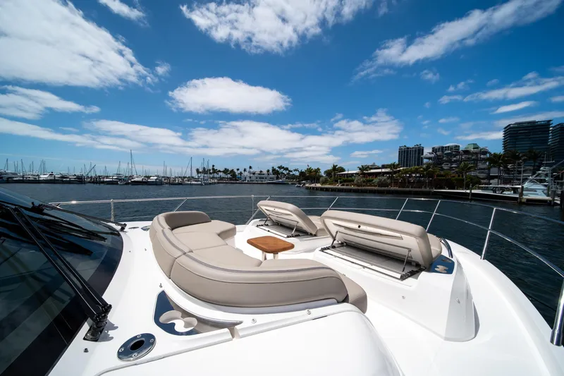 Slide: The Image of Luxurious 2025 Princess F65 yacht with spacious deck seating, docked in a scenic marina. - 37