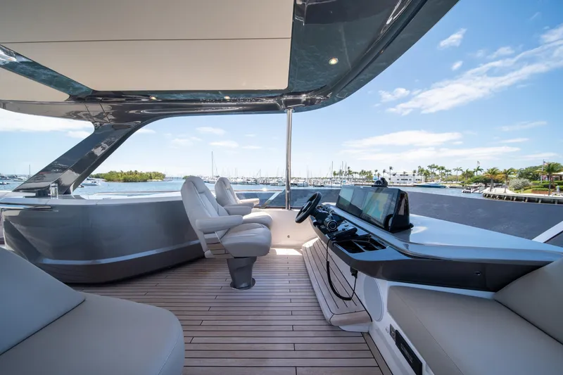 Slide: The Image of Luxurious 2025 Princess F65 yacht interior with modern helm and scenic marina view. - 38