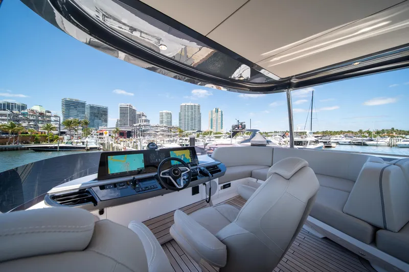 Slide: The Image of Luxurious 2025 Princess F65 yacht interior with modern helm and marina view. - 40