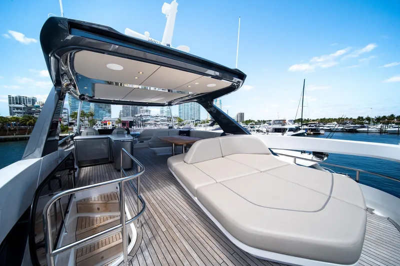 Slide: The Image of Luxurious 2025 Princess F65 yacht deck with seating, docked at marina. - 44