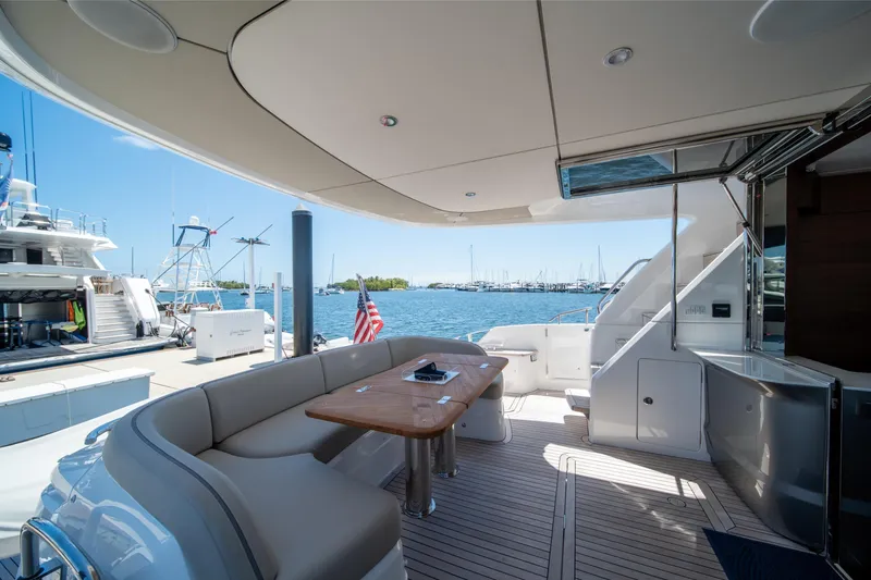 Slide: The Image of Luxurious 2025 Princess F65 yacht deck with seating, table, and ocean view. - 8