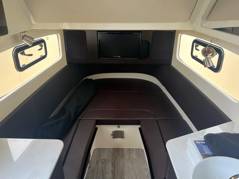 Slide: The Image of 2019 Scout 355 LXF cabin interior with TV and seating area. - 15