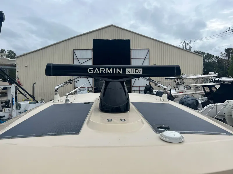 Slide: The Image of 2019 Scout 355 LXF boat with Garmin xHD2 radar in marina setting. - 22