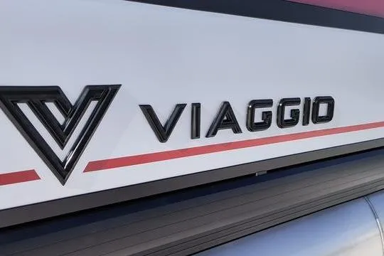 Slide: The Image of Viaggio x22u 2026 logo on vehicle side with red stripe. - 2