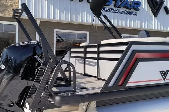 Slide: The Image of Viaggio x22u 2026 pontoon boat in front of marina building. - 4