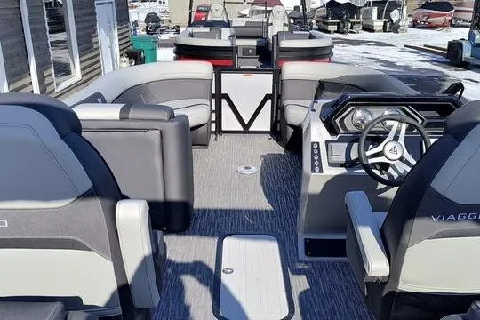 Slide: The Image of Interior of a 2026 Viaggio x22u boat with modern seating and helm console. - 5