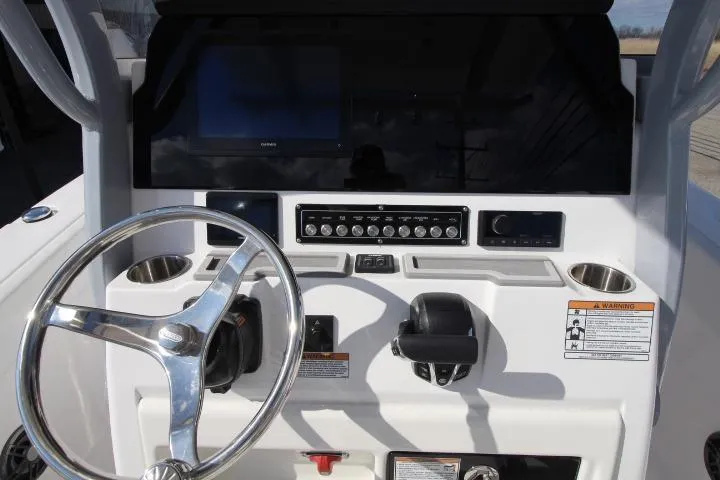 Slide: The Image of Sea Fox 248 Commander 2026 helm with steering wheel and controls. - 3