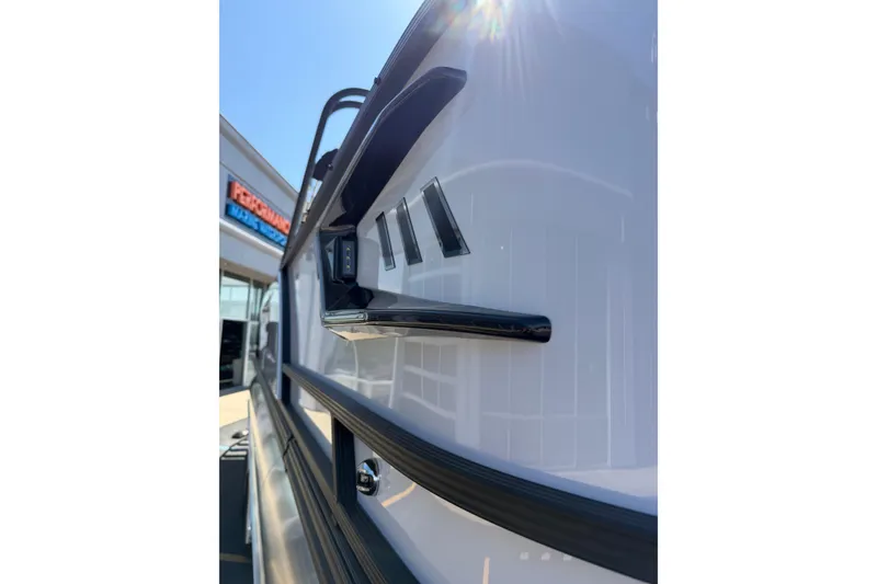 Slide: The Image of 2026 Crest Caribbean 250 SLS boat exterior detail with sleek design and modern features. - 12