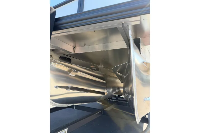 Slide: The Image of 2026 Crest Caribbean 250 SLS pontoon boat underside, showcasing sleek aluminum construction. - 14