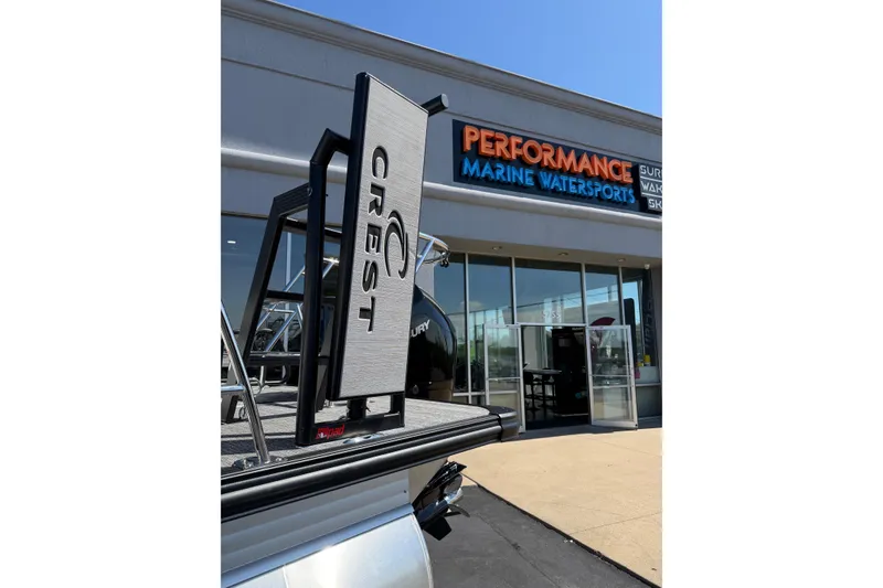 Slide: The Image of 2026 Crest Caribbean 250 SLS boat at Performance Marine Watersports dealership. - 16