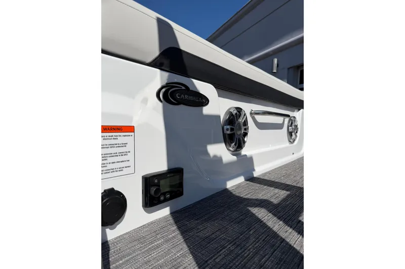 Slide: The Image of 2026 Crest Caribbean 250 SLS boat interior with speakers and control panel. - 17