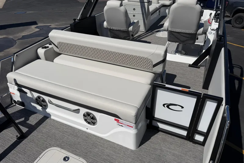 Slide: The Image of 2026 Crest Caribbean 250 SLS boat interior with plush seating and modern design. - 19