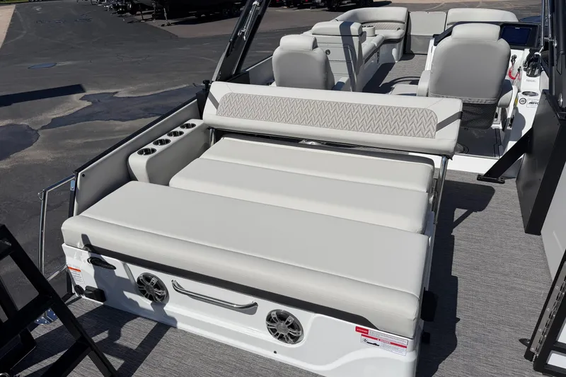 Slide: The Image of 2026 Crest Caribbean 250 SLS boat interior with luxurious seating and cup holders. - 21