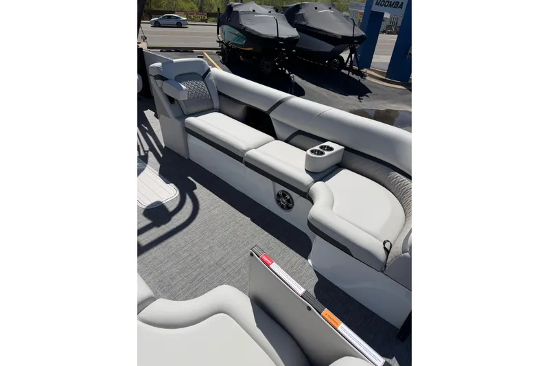 Slide: The Image of Luxurious seating on 2026 Crest Caribbean 250 SLS boat, featuring modern design and cup holders. - 26