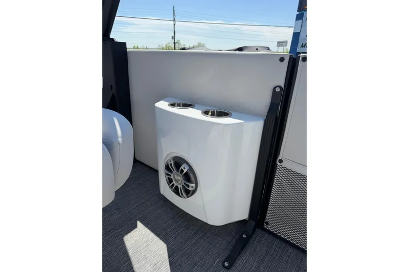 Slide: The Image of 2026 Crest Caribbean 250 SLS boat interior with speaker and cup holders. - 31