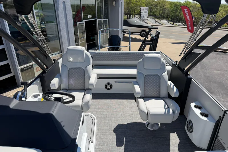 Slide: The Image of 2026 Crest Caribbean 250 SLS boat interior with plush seating and modern design. - 32