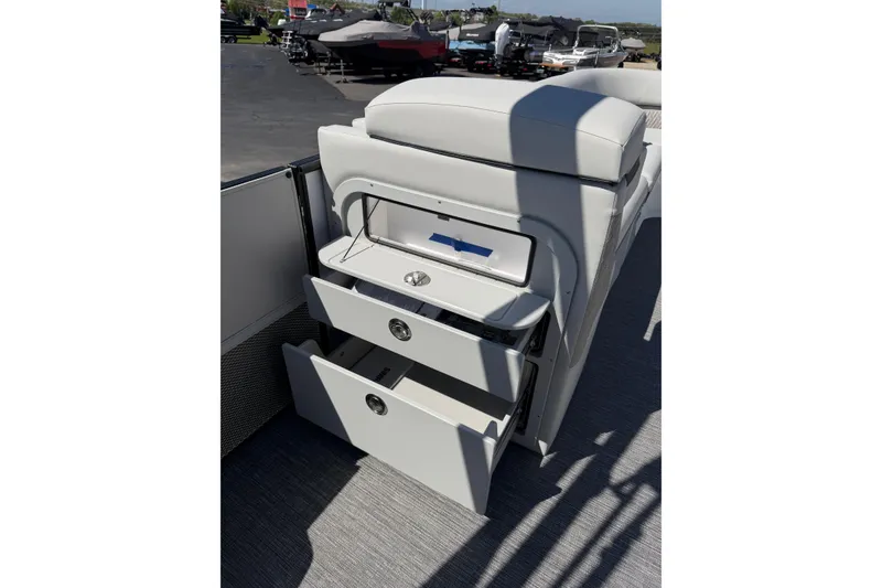 Slide: The Image of Interior storage drawers on 2026 Crest Caribbean 250 SLS boat. - 33