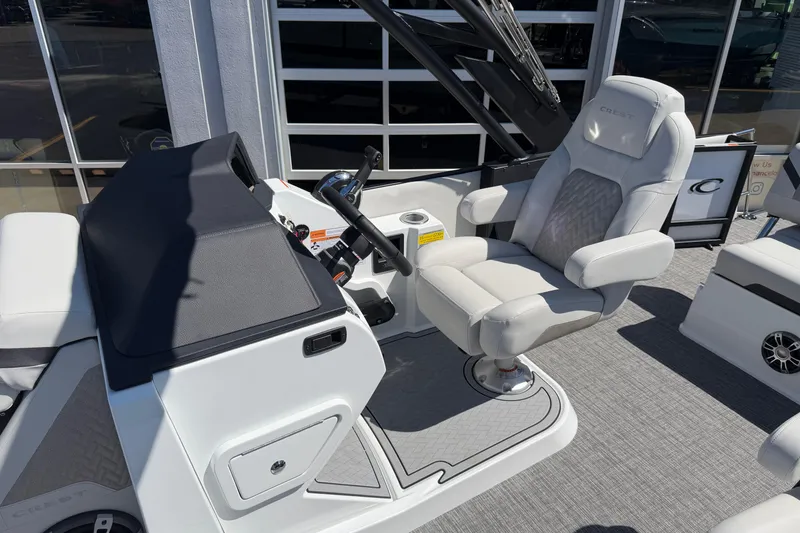 Slide: The Image of Captain's chair and helm of 2026 Crest Caribbean 250 SLS boat, featuring modern design. - 35