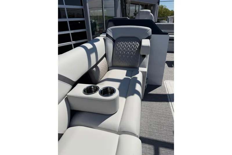Slide: The Image of Luxurious seating on 2026 Crest Caribbean 250 SLS boat with cup holders and stylish upholstery. - 40