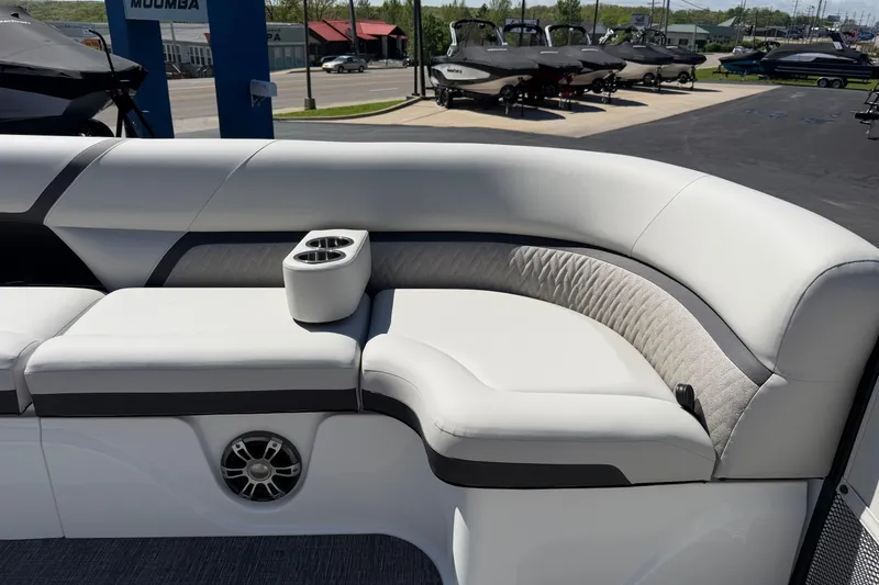 Slide: The Image of Luxurious seating on 2026 Crest Caribbean 250 SLS boat with cup holders and speaker. - 41