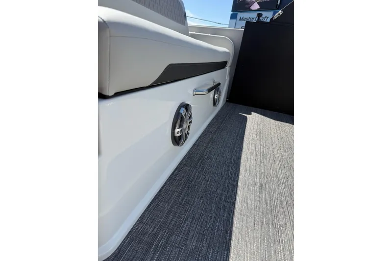 Slide: The Image of 2026 Crest Caribbean 250 SLS interior with sleek seating and modern speaker system. - 42