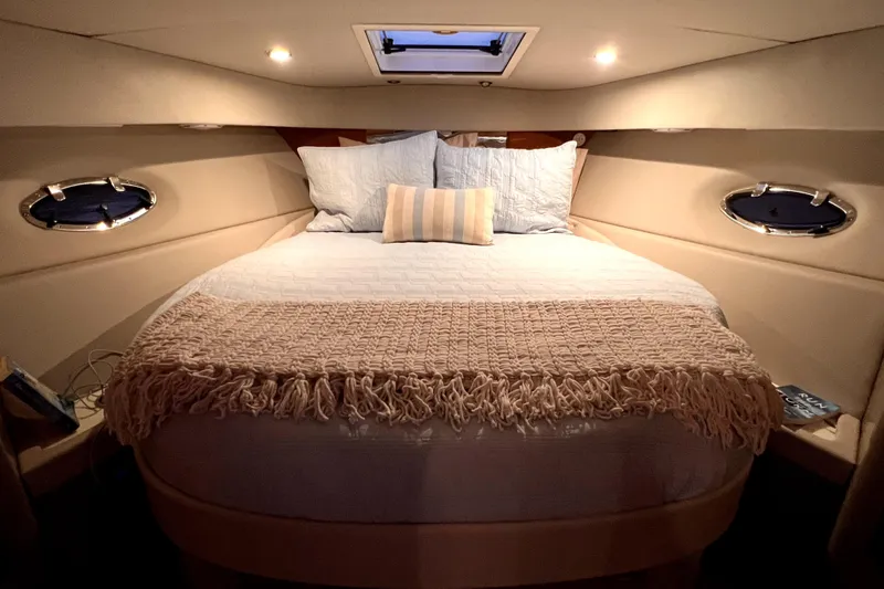 Slide: The Image of Luxurious cabin interior of a 2006 Formula 37 Performance Cruiser with cozy bedding. - 12