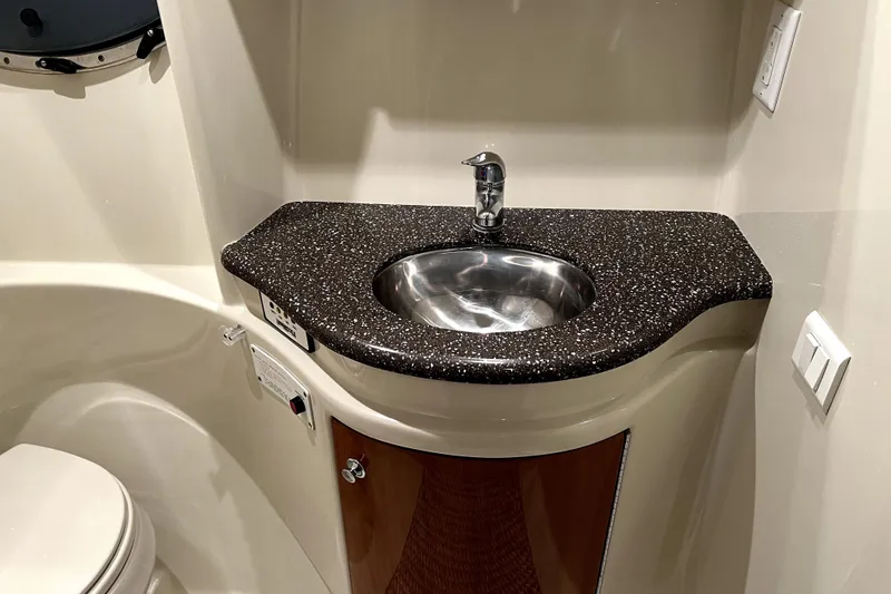 Slide: The Image of 2006 Formula 37 Performance Cruiser bathroom with sleek sink and countertop design. - 13