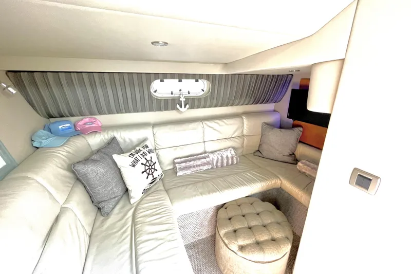 Slide: The Image of Luxurious interior of a 2006 Formula 37 Performance Cruiser with plush seating and nautical decor. - 17
