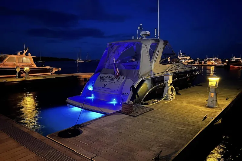 Slide: The Image of 2006 Formula 37 Performance Cruiser docked at night with blue underwater lights. - 5