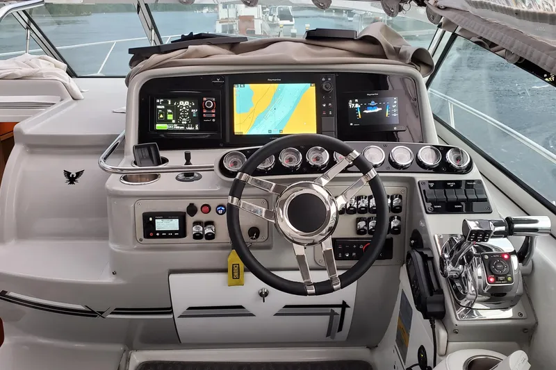 Slide: The Image of Cockpit of a 2006 Formula 37 Performance Cruiser with advanced navigation controls and displays. - 6