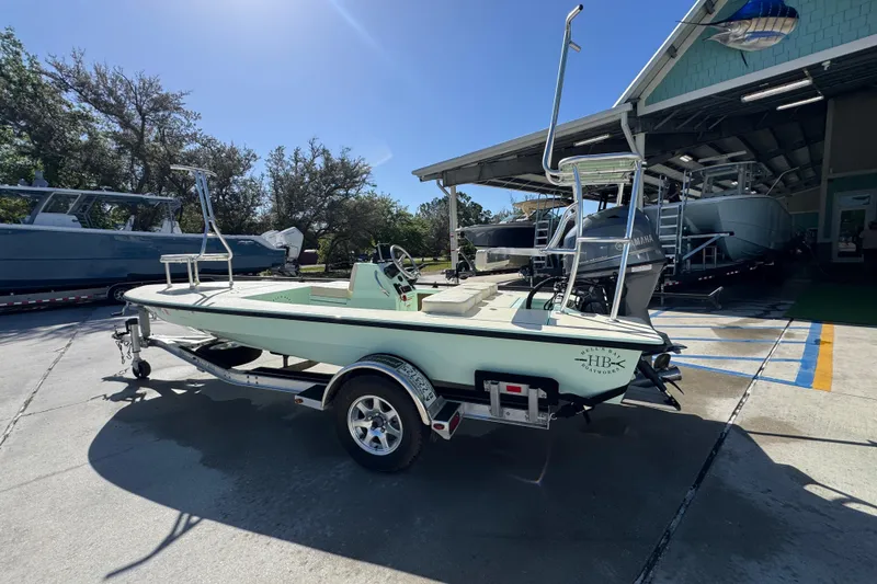 Slide: The Image of 2015 Hells Bay Professional boat on trailer in sunny outdoor setting. - 15