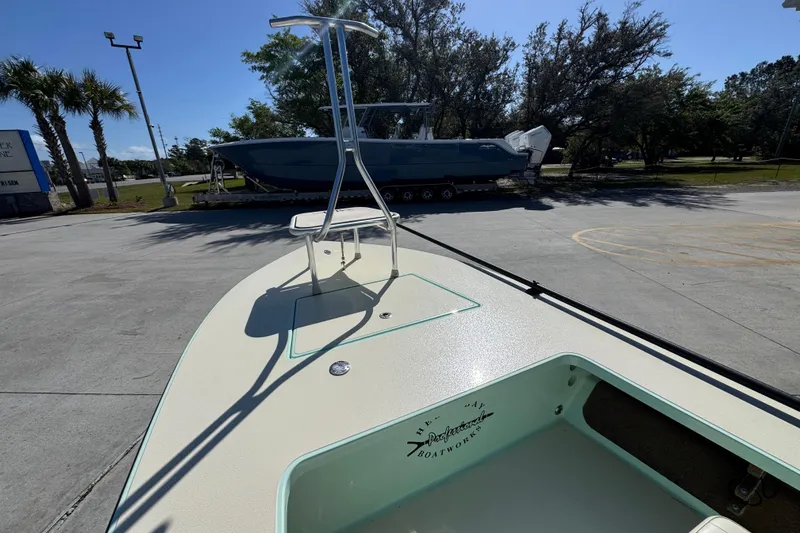 Slide: The Image of 2015 Hells Bay Professional boat on trailer in sunny outdoor setting. - 18