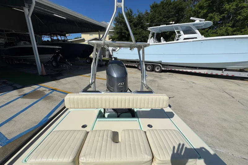 Slide: The Image of 2015 Hells Bay Professional boat with Yamaha 70 engine, parked in a marina. - 26