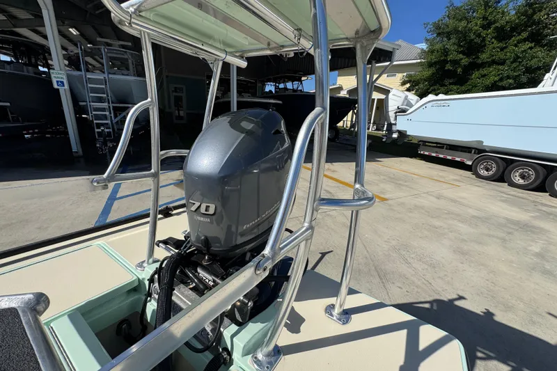 Slide: The Image of 2015 Hells Bay Professional boat with Yamaha 70 outboard motor in a marina setting. - 28