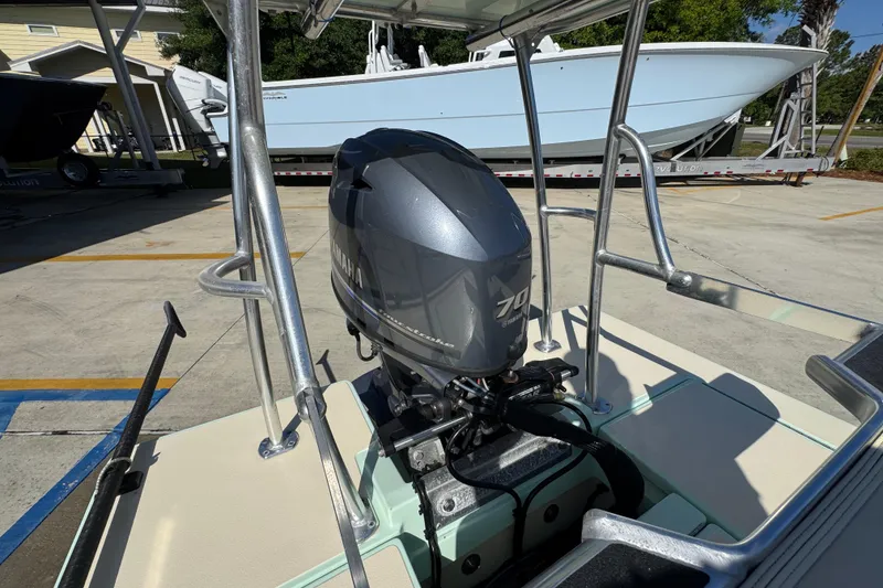 Slide: The Image of 2015 Hells Bay Professional boat with Yamaha 70 outboard motor in a parking area. - 29