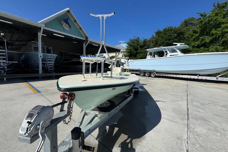 Slide: The Image of 2015 Hells Bay Professional boat on trailer at marina, sunny day. - 4