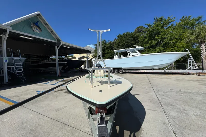 Slide: The Image of 2015 Hells Bay Professional boat on trailer at marina, clear sky background. - 5
