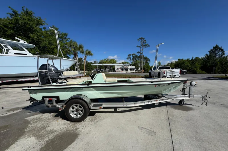 Slide: The Image of 2015 Hells Bay Professional boat on trailer, parked outdoors under clear blue sky. - 8