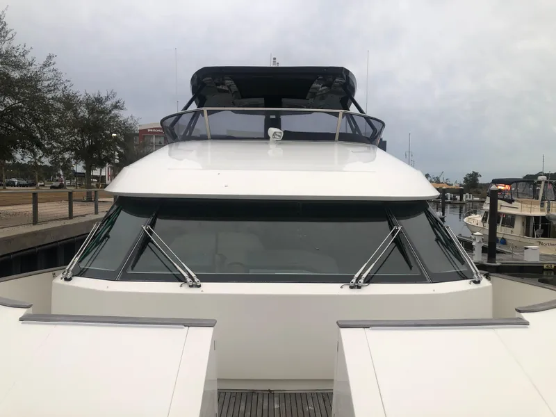 Slide: The Image of 2012 Monte Carlo Yachts 76 at dock, front view. - 11