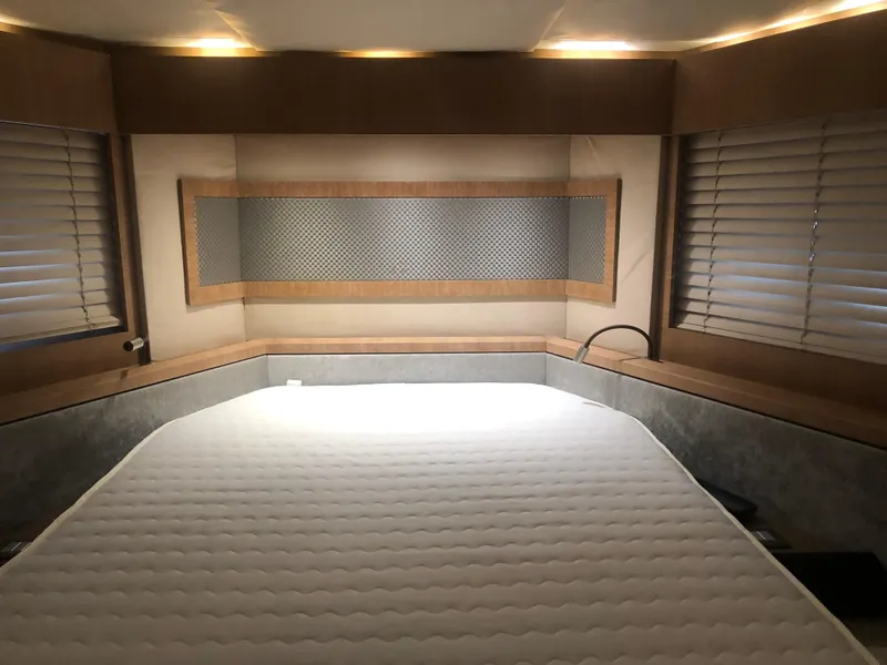 Slide: The Image of 2012 Monte Carlo Yachts 76 interior bedroom with modern design and large bed. - 12